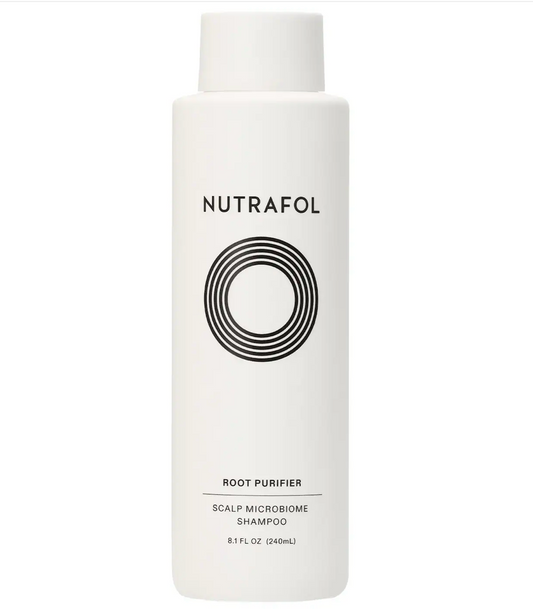 A bottle of Nutrafol Shampoo . Healthly scalp microbiome.
