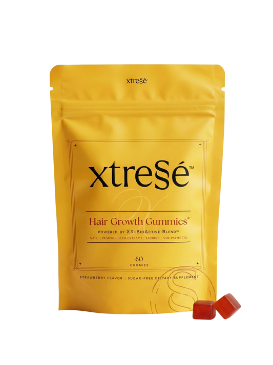 Xtresse hair growth gummies 1 month package with two gummies on a white background